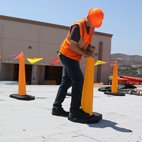 Step 3: Secure the base to the cone by standing on the base and pulling up on the cone