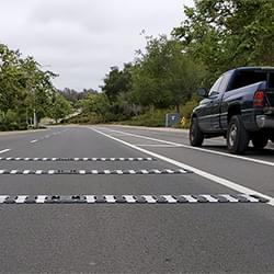 A Set of TrafFix Alert High Speed rumble strips setup on a roadway.