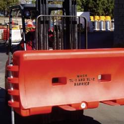 TrafFix Water-Cable Barrier being moves by a Forklift